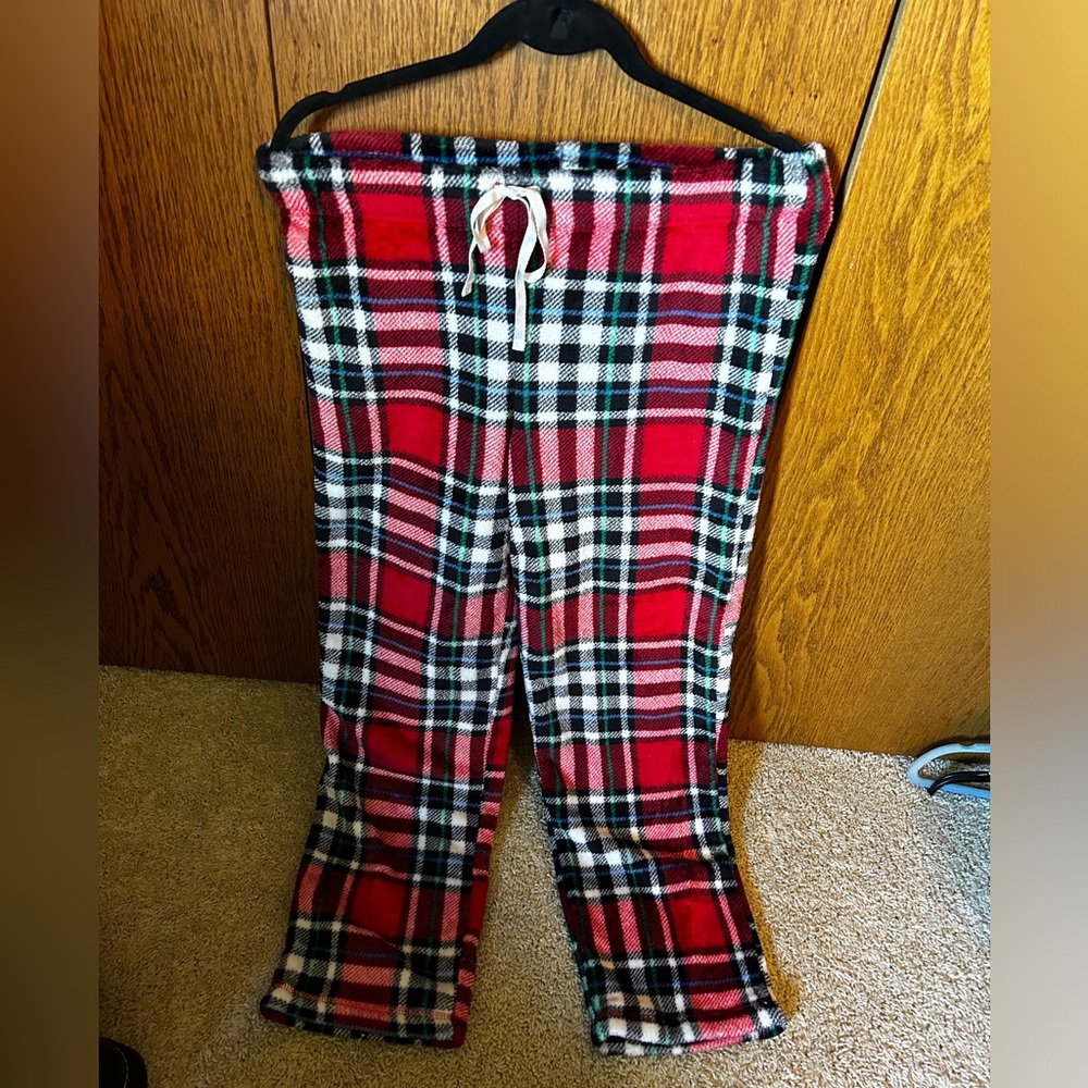 Red, green, and white fuzzy pants. Size medium.